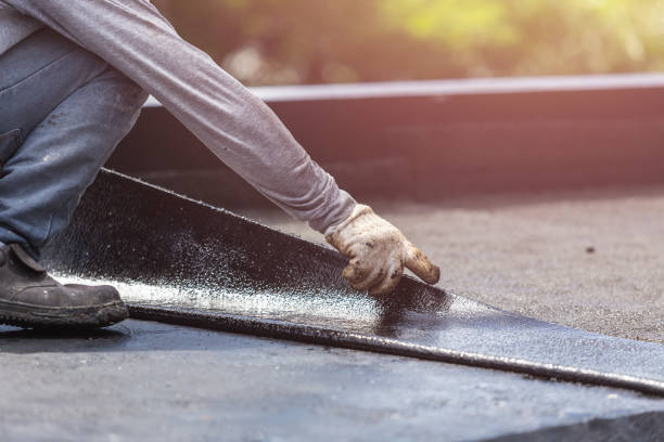 Professional Basement Waterproofing technician working in Kensington, MD